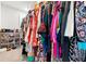 Walk-in closet features multiple shelves and racks of colorful clothing and shoes at 3952 Treebranch Cir Cir, Mount Pleasant, SC 29429