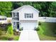 Charming two-story home featuring a manicured lawn, a two car garage, and tasteful landscaping at 3952 Treebranch Cir Cir, Mount Pleasant, SC 29429