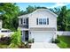 Charming two-story home featuring a manicured lawn, a two car garage, and tasteful landscaping at 3952 Treebranch Cir Cir, Mount Pleasant, SC 29429