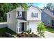 Attractive two-story home featuring a two-car garage, lush landscaping, and a cozy entrance at 3952 Treebranch Cir Cir, Mount Pleasant, SC 29429
