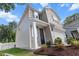 Exterior of home featuring a front porch, two-car garage, and well-maintained landscaping at 3952 Treebranch Cir Cir, Mount Pleasant, SC 29429