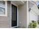 Close up of front door, light fixture and manicured landscaping at 3952 Treebranch Cir Cir, Mount Pleasant, SC 29429