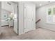 Hallway featuring carpet flooring, bedroom, doors, and stairway with light entering from window at 3952 Treebranch Cir Cir, Mount Pleasant, SC 29429
