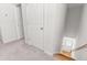 Hallway featuring carpet flooring, doors, and stairway with wood steps and light entering from window at 3952 Treebranch Cir Cir, Mount Pleasant, SC 29429