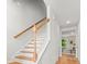 Welcoming hallway with staircase and hardwood floors leading to a bright, inviting living space at 3952 Treebranch Cir Cir, Mount Pleasant, SC 29429