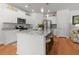 Bright kitchen with white cabinets, granite countertops, stainless steel appliances, and a large center island with seating at 3952 Treebranch Cir Cir, Mount Pleasant, SC 29429