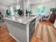 Kitchen island with white cabinets, stone countertop and stainless steel dishwasher at 3952 Treebranch Cir Cir, Mount Pleasant, SC 29429