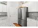 Modern kitchen featuring stainless steel refrigerator, white cabinets and granite countertops at 3952 Treebranch Cir Cir, Mount Pleasant, SC 29429