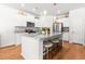 Bright kitchen with white cabinets, granite countertops, stainless steel appliances, and a large center island with seating at 3952 Treebranch Cir Cir, Mount Pleasant, SC 29429