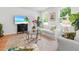 Bright living room with hardwood floors, cozy seating, and large windows with lush green views at 3952 Treebranch Cir Cir, Mount Pleasant, SC 29429