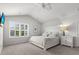 Main bedroom featuring a decorative bed, vaulted ceiling, and window with plantation shutters at 3952 Treebranch Cir Cir, Mount Pleasant, SC 29429