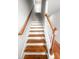 A carpeted staircase with wood railing leads to the upper level of the home at 3952 Treebranch Cir Cir, Mount Pleasant, SC 29429