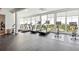 Bright fitness center with treadmills, stationary bikes, and large windows providing stunning views at 3997 Chantey Crest, Johns Island, SC 29455