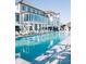 Stunning pool view, lined with lounge chairs and umbrellas, perfect for a relaxing day in the sun at 3997 Chantey Crest, Johns Island, SC 29455