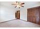 Bedroom with carpet, ceiling fan, and ample closet space at 415 Whitebark Dr, Ladson, SC 29456