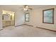Bright bedroom with ceiling fan, carpet, and large windows offering natural light at 415 Whitebark Dr, Ladson, SC 29456