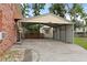 Large carport offering ample covered parking space with storage and convenient access to a storage shed at 415 Whitebark Dr, Ladson, SC 29456