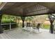 Outdoor gazebo with furniture, railing and black mesh at 415 Whitebark Dr, Ladson, SC 29456