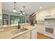 Stylish kitchen with a breakfast bar, granite countertops, and modern appliances at 415 Whitebark Dr, Ladson, SC 29456