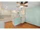 Bright eat-in kitchen with white cabinets, quartz countertops, and stainless steel appliances at 415 Whitebark Dr, Ladson, SC 29456