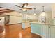Well-equipped kitchen adjacent to the living room, featuring modern appliances and ample cabinet space at 415 Whitebark Dr, Ladson, SC 29456