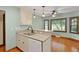 Charming kitchen bar with stainless steel sink, updated cabinets, and modern lighting at 415 Whitebark Dr, Ladson, SC 29456