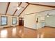 Inviting living room featuring hardwood floors and a bar overlooking the kitchen at 415 Whitebark Dr, Ladson, SC 29456
