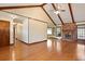 Bright living room with hardwood floors, vaulted ceilings, and a fireplace with a brick surround at 415 Whitebark Dr, Ladson, SC 29456