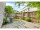 This backyard features a tall privacy fence and a small stone-paved patio at 4209 Climbing Tree Ct, Charleston, SC 29414