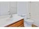 Bathroom featuring wood cabinets, a mirror, white toilet and a shower with tub at 4209 Climbing Tree Ct, Charleston, SC 29414