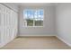 Bedroom features double door closet, neutral paint and carpet at 4209 Climbing Tree Ct, Charleston, SC 29414