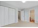 Neutral bedroom featuring large closet doors and an ensuite bathroom entrance at 4209 Climbing Tree Ct, Charleston, SC 29414