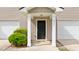 Inviting front entrance with a black door, white columns, and well-manicured shrubbery at 4209 Climbing Tree Ct, Charleston, SC 29414