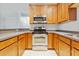 Kitchen features wooden cabinets, stainless steel appliances and quartz countertops at 4209 Climbing Tree Ct, Charleston, SC 29414