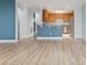 Open-concept living room with a view of the kitchen and stainless steel appliances at 4209 Climbing Tree Ct, Charleston, SC 29414