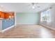 Open-concept living area with an eat-in kitchen, hardwood floors, and stylish light fixtures at 4209 Climbing Tree Ct, Charleston, SC 29414