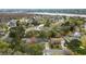 An aerial view of the neighborhood reveals lush tree coverage, waterways, and charming homes in a peaceful setting at 4343 Helene Dr, North Charleston, SC 29418