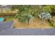 A spacious backyard provides a private and natural retreat with a mature palm tree and lush foliage at 4343 Helene Dr, North Charleston, SC 29418