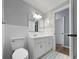 Bright bathroom featuring tiled floors, a mirror, a vanity with storage, and neutral paint at 4343 Helene Dr, North Charleston, SC 29418