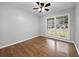 Bright bedroom featuring hardwood floors, a ceiling fan, and double windows offering ample natural light at 4343 Helene Dr, North Charleston, SC 29418