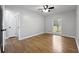 Bedroom with hardwood floors, neutral paint, a ceiling fan, and an exterior view window at 4343 Helene Dr, North Charleston, SC 29418