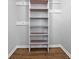 A closet featuring a built in shelving unit with wood-grained shelves provides ample storage space at 4343 Helene Dr, North Charleston, SC 29418
