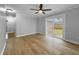 A bright dining room with hardwood floors, neutral colors, and sliding door access to the backyard at 4343 Helene Dr, North Charleston, SC 29418