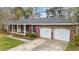 Charming brick home with a manicured lawn, a double garage and inviting entryway for a cozy curb appeal at 4343 Helene Dr, North Charleston, SC 29418