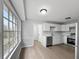 Modern kitchen with stainless steel appliances, hardwood floors, and ample natural light at 4343 Helene Dr, North Charleston, SC 29418