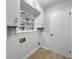 Practical laundry room with cabinet storage, window and vinyl floors at 4343 Helene Dr, North Charleston, SC 29418