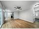 Open-concept living space with hardwood floors connecting living and kitchen areas with natural light at 4343 Helene Dr, North Charleston, SC 29418