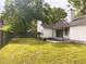 This backyard features a patio, a large grassy area, and a wood fence at 4414 Rice Mill Dr, North Charleston, SC 29420