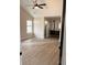 This bedroom features an ensuite bathroom, a ceiling fan, and wood-look floors at 4414 Rice Mill Dr, North Charleston, SC 29420