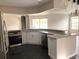 Well-lit kitchen showcasing granite counters, stainless steel appliances, and a modern design at 4414 Rice Mill Dr, North Charleston, SC 29420